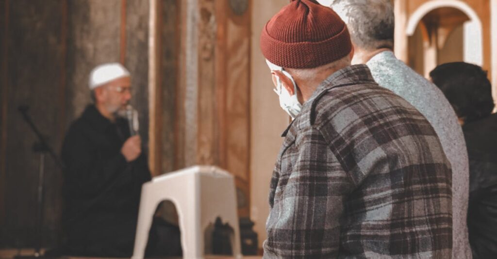 pexels photo 29513358 29513358 Men engaged in prayer inside a historic mosque in Istanbul with intricate interior design.